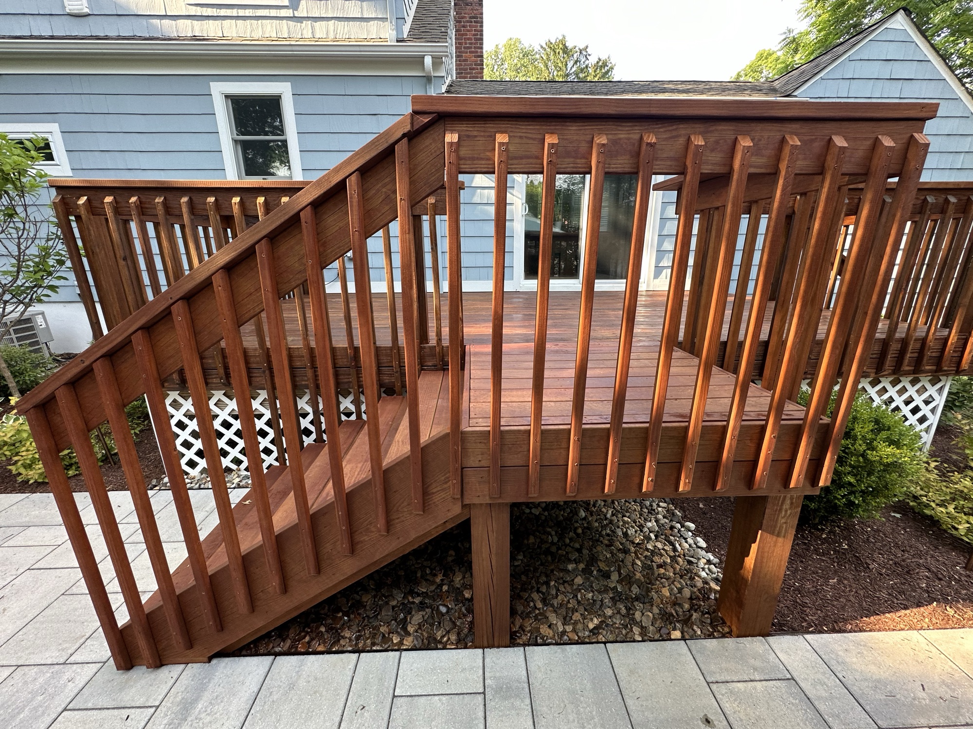 Beautifully stained deck with rich wood tone by J&B Painting
