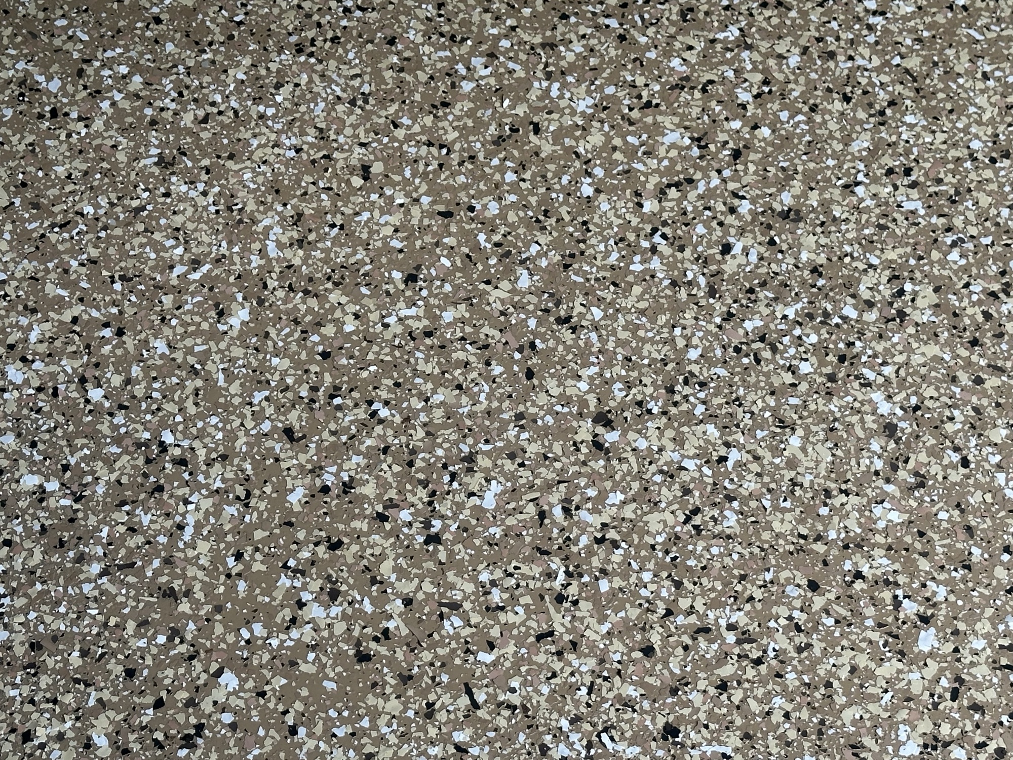 Epoxy floor close-up showing flake texture by J&B Painting