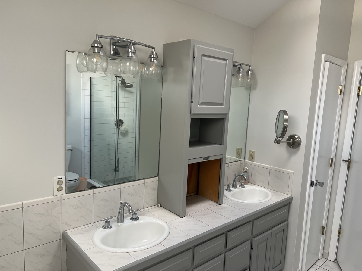 Refinished bathroom vanity wide angle with vanity lighting