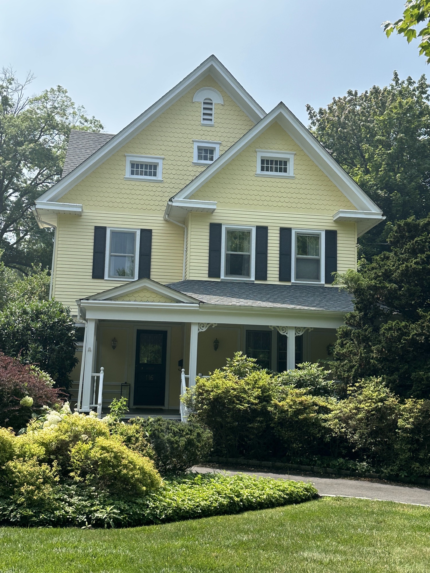 Yellow Victorian home exterior painting by J&B Painting