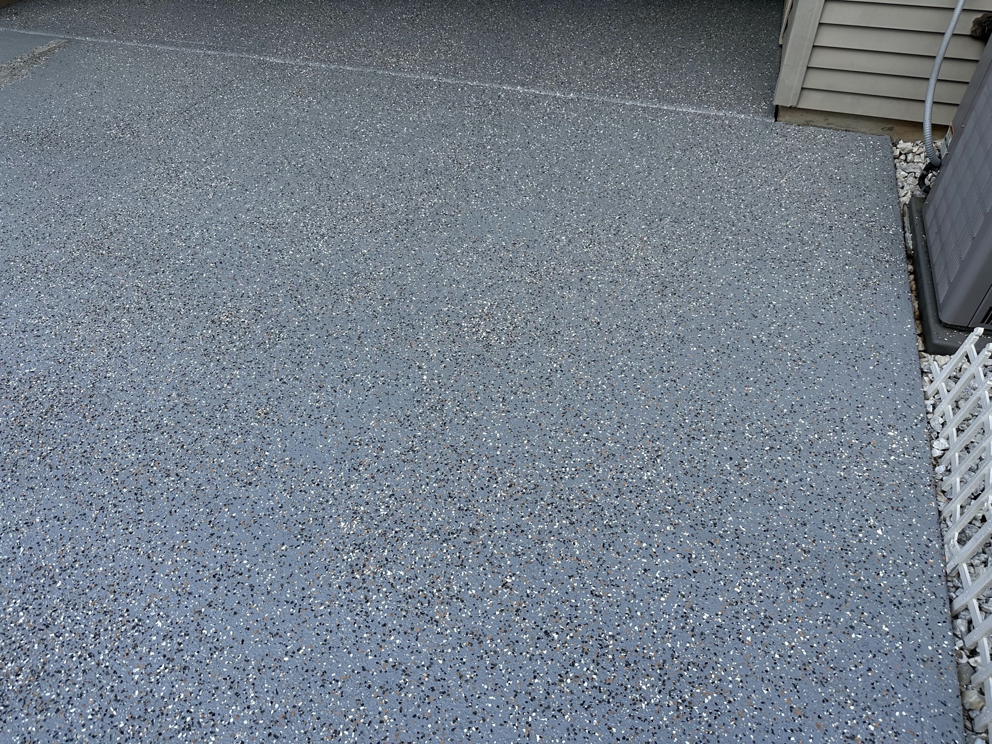 Epoxy floor coating residential garage by J&B Painting